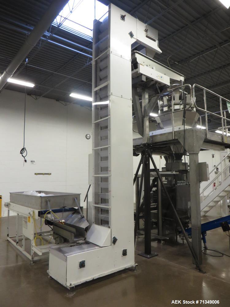 Used Matrix Mercury Model  2840R Vertical form fill and seal packaging system. Complete line includes with Yamato Zigma Series 10 head  dimpled/embossed bucket scale , Has mild steel platform, hot st...