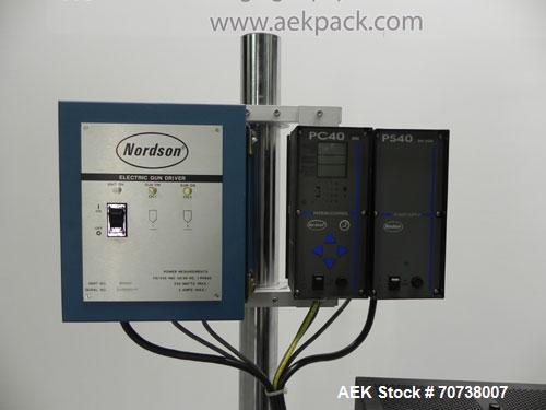 Used Nordson Series 3100 Hot Melt Glue System. System is complete with (1) Nordson PC40 pattern controller, (1) Nordson PS40 power supply, and (1) Nordson electric gun driver. Glue unit also has (1) ...