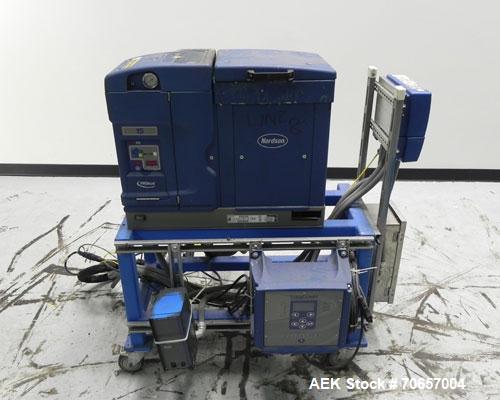 Used Nordson Model ProBlue 15 Hot Melt Glue System. Has Nodson model EPC 30 Eclipse series pattern controller. Has LogiComm glue gun driver. Mounted on stand alone frame with casters. Includes glue h...