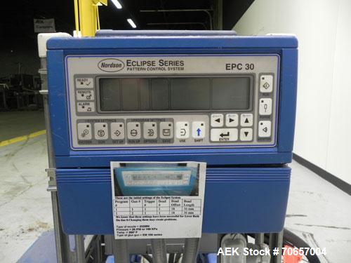 Used Nordson Model ProBlue 15 Hot Melt Glue System. Has Nodson model EPC 30 Eclipse series pattern controller. Has LogiComm glue gun driver. Mounted on stand alone frame with casters. Includes glue h...