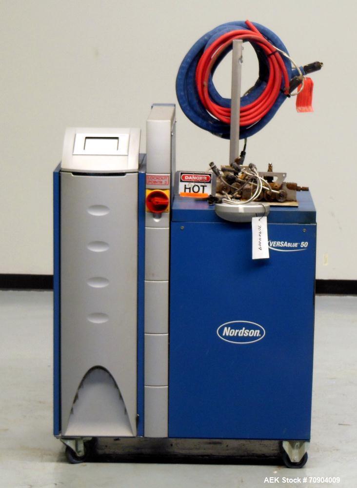Used Nordson VersaBlue 50 Glue System. Built 2004. Has a holding capacity of 50 Liters, Maximum 6 hoses/guns, throughput per hour 165 lbs (75kg), Melt Rate per hour 110 lbs (50kg). 3/230V/50/60HZ. Ha...