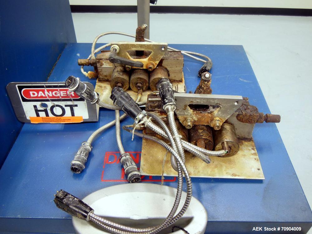 Used Nordson VersaBlue 50 Glue System. Built 2004. Has a holding capacity of 50 Liters, Maximum 6 hoses/guns, throughput per hour 165 lbs (75kg), Melt Rate per hour 110 lbs (50kg). 3/230V/50/60HZ. Ha...