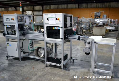 Used PVA (Halfmoon NY) Glue Applicator, serial #C1055, with cooling section. Features twin Rexroth 2” table top chain conveyors which introduce bottle to glue nozzles, then manual “shell/cap” placing...