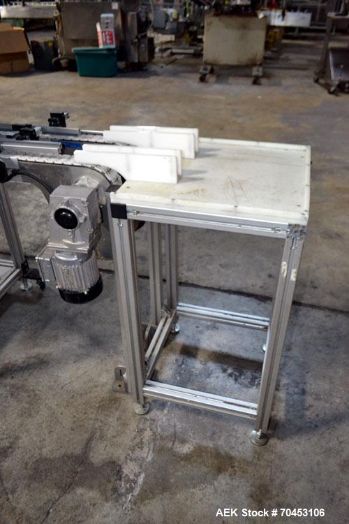 Used PVA (Halfmoon NY) Glue Applicator, serial #C1055, with cooling section. Features twin Rexroth 2” table top chain conveyors which introduce bottle to glue nozzles, then manual “shell/cap” placing...