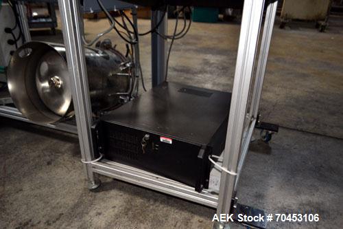 Used PVA (Halfmoon NY) Glue Applicator, serial #C1055, with cooling section. Features twin Rexroth 2” table top chain conveyors which introduce bottle to glue nozzles, then manual “shell/cap” placing...