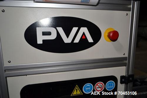 Used PVA (Halfmoon NY) Glue Applicator, serial #C1055, with cooling section. Features twin Rexroth 2” table top chain conveyors which introduce bottle to glue nozzles, then manual “shell/cap” placing...