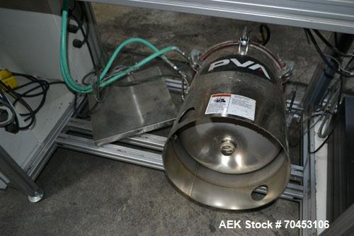 Used PVA (Halfmoon NY) Glue Applicator, serial #C1055, with cooling section. Features twin Rexroth 2” table top chain conveyors which introduce bottle to glue nozzles, then manual “shell/cap” placing...