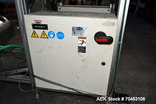 Used PVA (Halfmoon NY) Glue Applicator, serial #C1055, with cooling section. Features twin Rexroth 2” table top chain conveyors which introduce bottle to glue nozzles, then manual “shell/cap” placing...