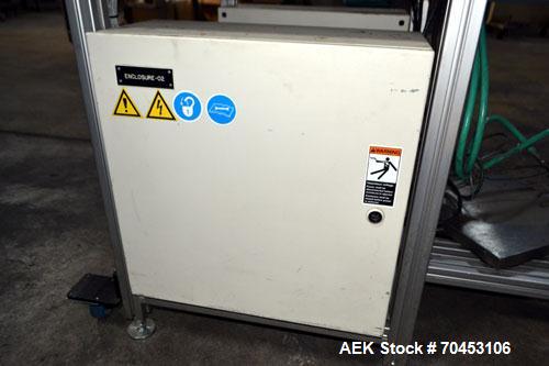Used PVA (Halfmoon NY) Glue Applicator, serial #C1055, with cooling section. Features twin Rexroth 2” table top chain conveyors which introduce bottle to glue nozzles, then manual “shell/cap” placing...