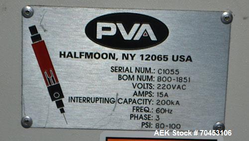 Used PVA (Halfmoon NY) Glue Applicator, serial #C1055, with cooling section. Features twin Rexroth 2” table top chain conveyors which introduce bottle to glue nozzles, then manual “shell/cap” placing...
