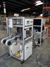 Used PVA (Halfmoon NY) Glue Applicator, serial #C1055, with cooling section. Features twin Rexroth 2” table top chain conveyors which introduce bottle to glue nozzles, then manual “shell/cap” placing...