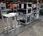 Used PVA (Halfmoon NY) Glue Applicator, serial #C1055, with cooling section. Features twin Rexroth 2” table top chain conveyors which introduce bottle to glue nozzles, then manual “shell/cap” placing...