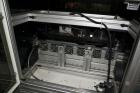 Used PVA (Halfmoon NY) Glue Applicator, serial #C1055, with cooling section. Features twin Rexroth 2” table top chain conveyors which introduce bottle to glue nozzles, then manual “shell/cap” placing...