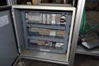 Used PVA (Halfmoon NY) Glue Applicator, serial #C1055, with cooling section. Features twin Rexroth 2” table top chain conveyors which introduce bottle to glue nozzles, then manual “shell/cap” placing...