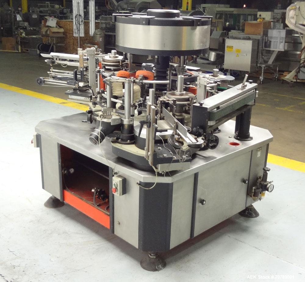 Used Cavagnino & Gatti front back and neck glue labeler. Capable of speeds from 3000 to 8000 bottles per hour. Gluer and Labeler, Series CG84, Model CG84C2/R/7SF C4441, Yr. 1987