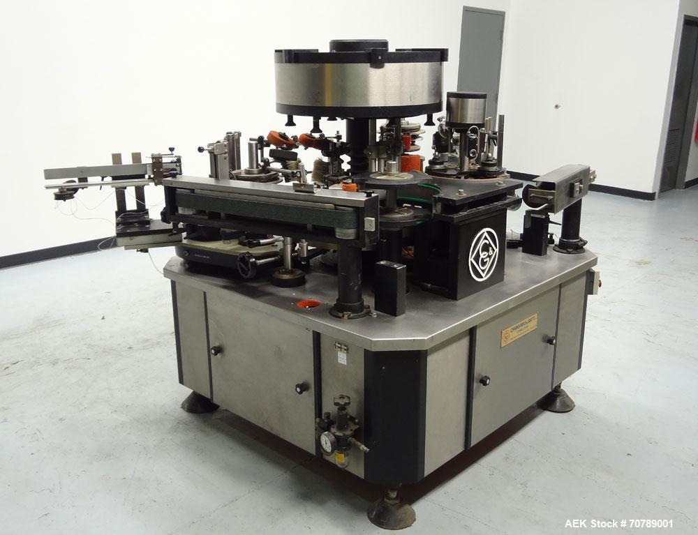 Used Cavagnino & Gatti front back and neck glue labeler. Capable of speeds from 3000 to 8000 bottles per hour. Gluer and Labeler, Series CG84, Model CG84C2/R/7SF C4441, Yr. 1987