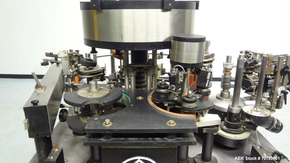 Used Cavagnino & Gatti front back and neck glue labeler. Capable of speeds from 3000 to 8000 bottles per hour. Gluer and Labeler, Series CG84, Model CG84C2/R/7SF C4441, Yr. 1987