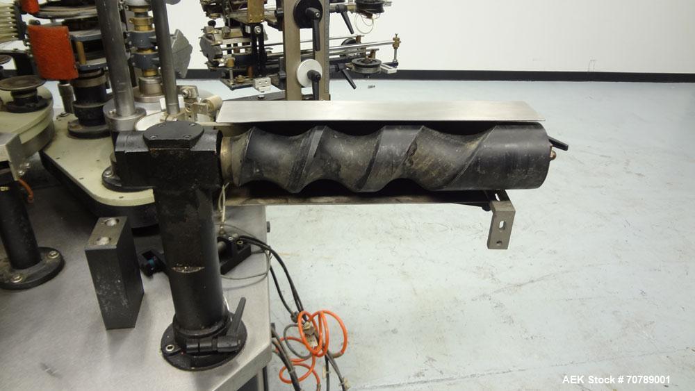 Used Cavagnino & Gatti front back and neck glue labeler. Capable of speeds from 3000 to 8000 bottles per hour. Gluer and Labeler, Series CG84, Model CG84C2/R/7SF C4441, Yr. 1987