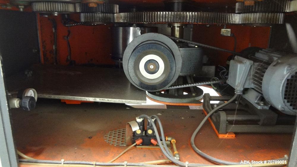 Used Cavagnino & Gatti front back and neck glue labeler. Capable of speeds from 3000 to 8000 bottles per hour. Gluer and Labeler, Series CG84, Model CG84C2/R/7SF C4441, Yr. 1987