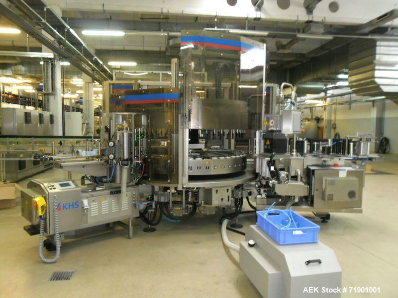 Used KHS AG Front, Back and Neck Glue Labeling Machine. Type Innoket SE 2080/120-48LM GT. Cold glue configuration. Capacity 66000 containers/hour. 73.6” (1888 mm) diameter turn table/carousel. 48 pcs...