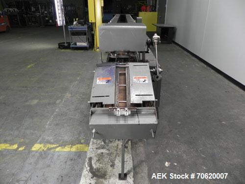 Used Mateer Burt 704 Automatic Roll Through Hot Glue Wraparound Labeler. Capable of speeds up to 600 labels per minute depending on materials and application. Can size range: 1-3/4" to 7-1/4" in diam...