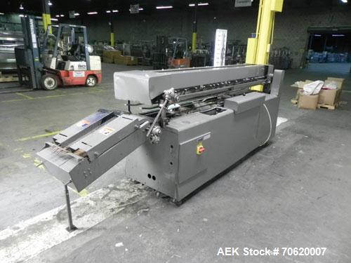 Used Mateer Burt 704 Automatic Roll Through Hot Glue Wraparound Labeler. Capable of speeds up to 600 labels per minute depending on materials and application. Can size range: 1-3/4" to 7-1/4" in diam...