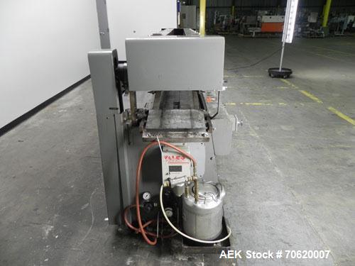 Used Mateer Burt 704 Automatic Roll Through Hot Glue Wraparound Labeler. Capable of speeds up to 600 labels per minute depending on materials and application. Can size range: 1-3/4" to 7-1/4" in diam...