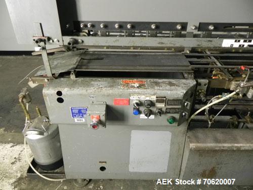 Used Mateer Burt 704 Automatic Roll Through Hot Glue Wraparound Labeler. Capable of speeds up to 600 labels per minute depending on materials and application. Can size range: 1-3/4" to 7-1/4" in diam...