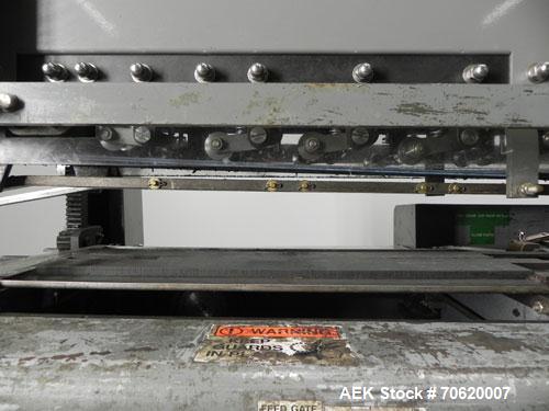 Used Mateer Burt 704 Automatic Roll Through Hot Glue Wraparound Labeler. Capable of speeds up to 600 labels per minute depending on materials and application. Can size range: 1-3/4" to 7-1/4" in diam...