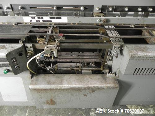 Used Mateer Burt 704 Automatic Roll Through Hot Glue Wraparound Labeler. Capable of speeds up to 600 labels per minute depending on materials and application. Can size range: 1-3/4" to 7-1/4" in diam...