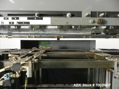 Used Mateer Burt 704 Automatic Roll Through Hot Glue Wraparound Labeler. Capable of speeds up to 600 labels per minute depending on materials and application. Can size range: 1-3/4" to 7-1/4" in diam...