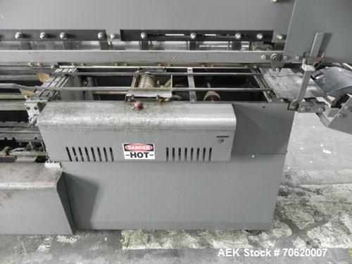 Used Mateer Burt 704 Automatic Roll Through Hot Glue Wraparound Labeler. Capable of speeds up to 600 labels per minute depending on materials and application. Can size range: 1-3/4" to 7-1/4" in diam...