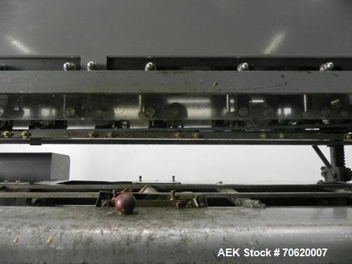 Used Mateer Burt 704 Automatic Roll Through Hot Glue Wraparound Labeler. Capable of speeds up to 600 labels per minute depending on materials and application. Can size range: 1-3/4" to 7-1/4" in diam...
