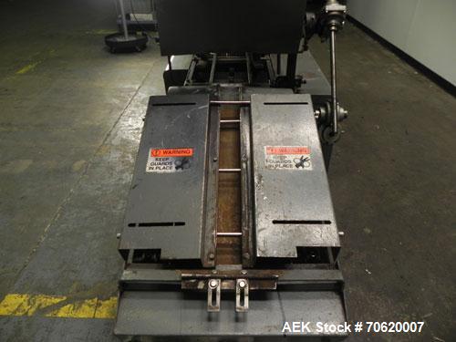 Used Mateer Burt 704 Automatic Roll Through Hot Glue Wraparound Labeler. Capable of speeds up to 600 labels per minute depending on materials and application. Can size range: 1-3/4" to 7-1/4" in diam...