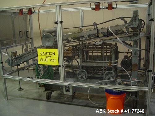 Used NewWay Roll Through Glue Wraparound Labeler, Model E5C5B. Capable of speeds up to 500 cpm. Will label metal cans, jars, plastic bottles or composite cans. Container size range: diameter 1.75" to...