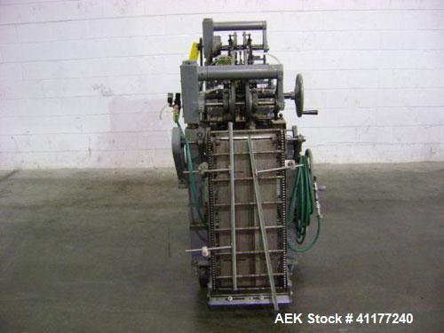 Used NewWay Roll Through Glue Wraparound Labeler, Model E5C5B. Capable of speeds up to 500 cpm. Will label metal cans, jars, plastic bottles or composite cans. Container size range: diameter 1.75" to...