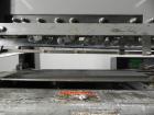 Used Mateer Burt 704 Automatic Roll Through Hot Glue Wraparound Labeler. Capable of speeds up to 600 labels per minute depending on materials and application. Can size range: 1-3/4
