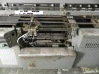 Used Mateer Burt 704 Automatic Roll Through Hot Glue Wraparound Labeler. Capable of speeds up to 600 labels per minute depending on materials and application. Can size range: 1-3/4