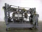 Used NewWay Roll Through Glue Wraparound Labeler, Model E5C5B. Capable of speeds up to 500 cpm. Will label metal cans, jars, plastic bottles or composite cans. Container size range: diameter 1.75