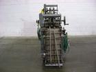 Used NewWay Roll Through Glue Wraparound Labeler, Model E5C5B. Capable of speeds up to 500 cpm. Will label metal cans, jars, plastic bottles or composite cans. Container size range: diameter 1.75
