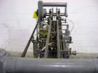 Used NewWay Roll Through Glue Wraparound Labeler, Model E5C5B. Capable of speeds up to 500 cpm. Will label metal cans, jars, plastic bottles or composite cans. Container size range: diameter 1.75