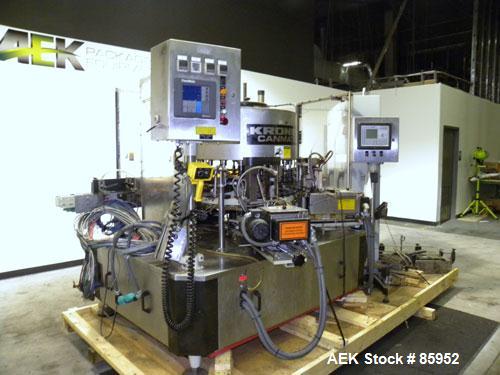 Used Krones Canmatic Rotary Hot Glue Wraparound Labeler. 18 hd Capable of running up to 600 cpm. Container size range: 50-110mm diameter, 50-250mm or 150-350mm height. 18 head unit set on 126mm pitch...