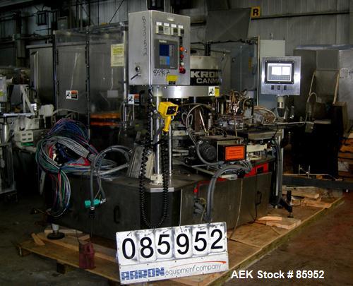 Used Krones Canmatic Rotary Hot Glue Wraparound Labeler. 18 hd Capable of running up to 600 cpm. Container size range: 50-110mm diameter, 50-250mm or 150-350mm height. 18 head unit set on 126mm pitch...