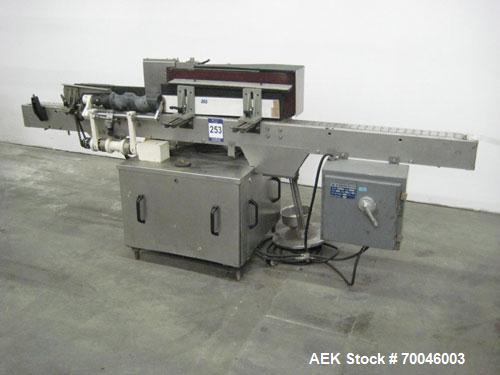 Used Krones Rotina I Wraparound Cold Glue Labeler. Cable of speeds up to 80 bottles per minute on wraparound or 100 bottles per minute on spot labels. Has a label size range: length 2" to 14", width ...
