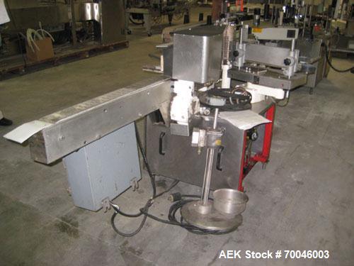 Used Krones Rotina I Wraparound Cold Glue Labeler. Cable of speeds up to 80 bottles per minute on wraparound or 100 bottles per minute on spot labels. Has a label size range: length 2" to 14", width ...
