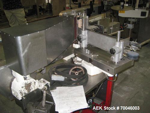 Used Krones Rotina I Wraparound Cold Glue Labeler. Cable of speeds up to 80 bottles per minute on wraparound or 100 bottles per minute on spot labels. Has a label size range: length 2" to 14", width ...