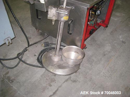 Used Krones Rotina I Wraparound Cold Glue Labeler. Cable of speeds up to 80 bottles per minute on wraparound or 100 bottles per minute on spot labels. Has a label size range: length 2" to 14", width ...