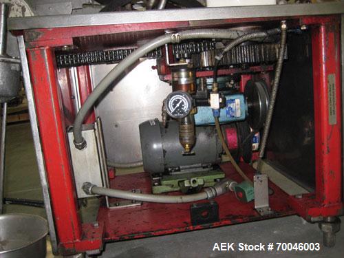Used Krones Rotina I Wraparound Cold Glue Labeler. Cable of speeds up to 80 bottles per minute on wraparound or 100 bottles per minute on spot labels. Has a label size range: length 2" to 14", width ...