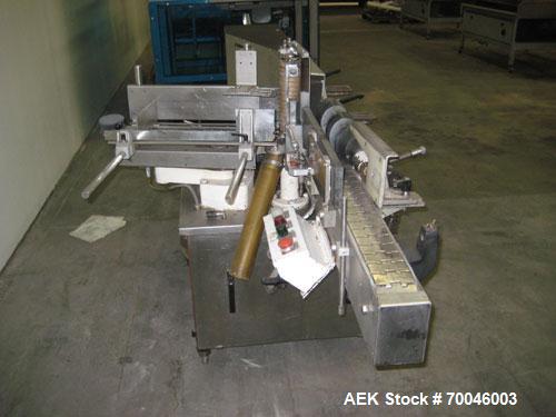 Used Krones Rotina I Wraparound Cold Glue Labeler. Cable of speeds up to 80 bottles per minute on wraparound or 100 bottles per minute on spot labels. Has a label size range: length 2" to 14", width ...