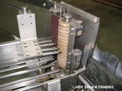 Used Krones Rotina I Wraparound Cold Glue Labeler. Cable of speeds up to 80 bottles per minute on wraparound or 100 bottles per minute on spot labels. Has a label size range: length 2" to 14", width ...
